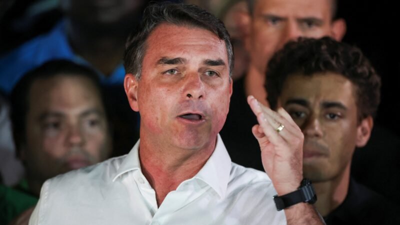 What are the investigations into Flávio Bolsonaro, the defeated presidential candidate who fled Brazil for the US?